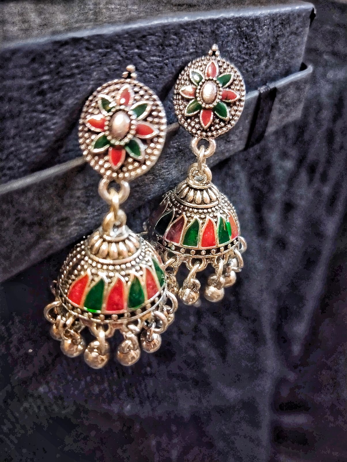 "Pair of vibrant Red and Green Meena Kaari Jhumki Earrings, part of the Mystic Meena Kaari Jewelry Collection."