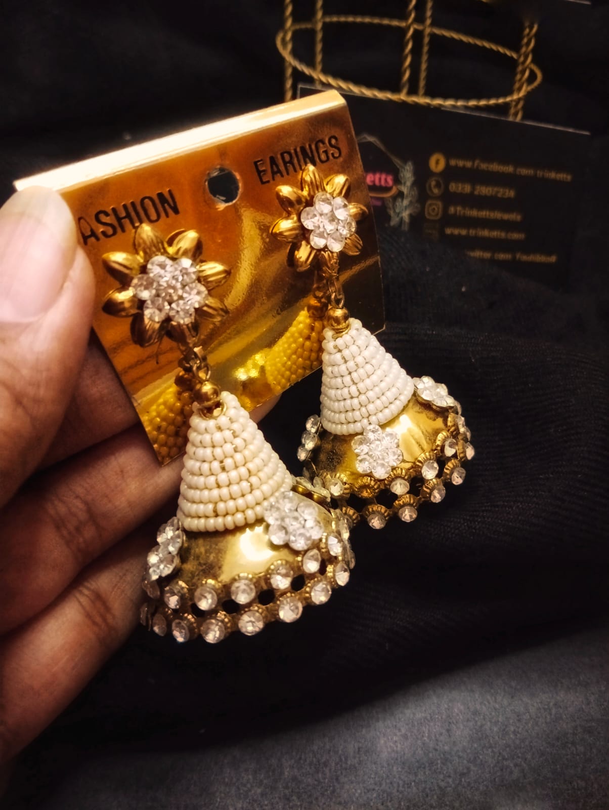 Close-up view of the White Beaded Jhumka Earring, showcasing intricate white beadwork and gemstone alignment at the end