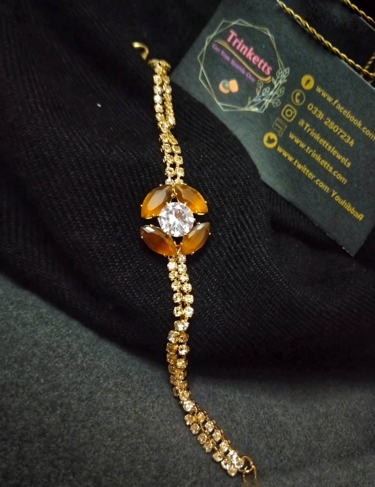 Elegant Rust Flower Stone Bracelet: Handcrafted with a captivating rust-colored stone flower. Sparkling zircon-twisted straps enhance its allure, adding sophistication to any look.