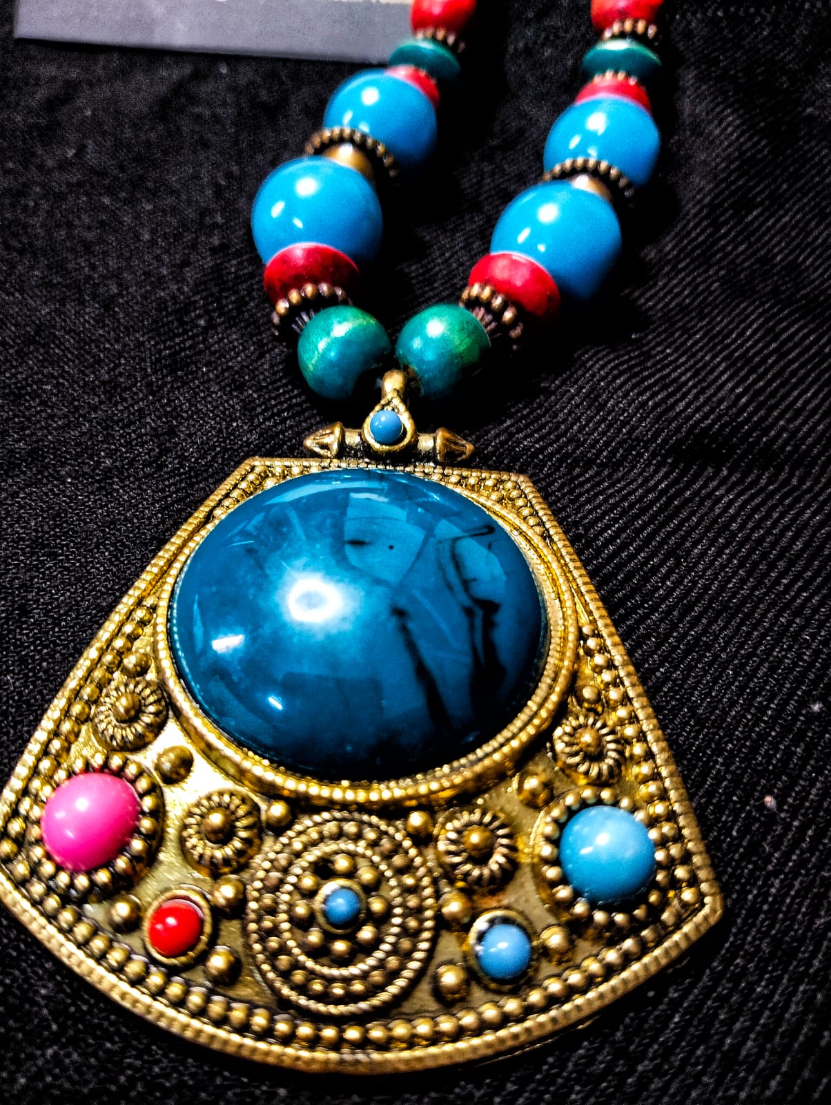 Brass-Colored Metal Pendant with Blue Plastic Stones on Antique-Style Maala Necklace