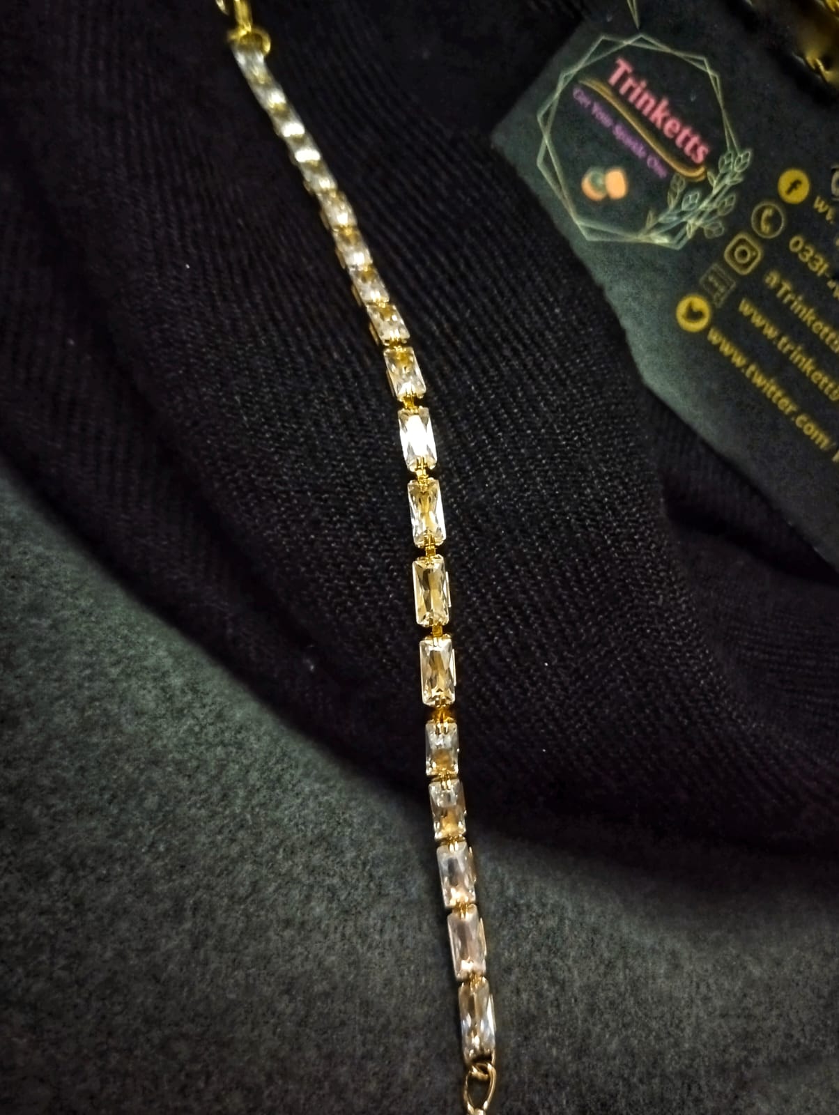Close-up image of a stunning single-strand bracelet adorned with sparkling zircon stones in a brilliant transparent hue. The bracelet exudes timeless elegance and sophistication