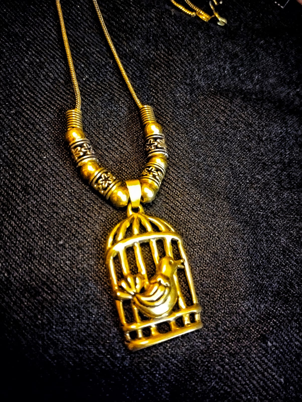 Oxidized Golden Maala Pendant: A captivating golden pendant with an oxidized finish, featuring an intricate cage-style design and a delicate bird motif suspended within