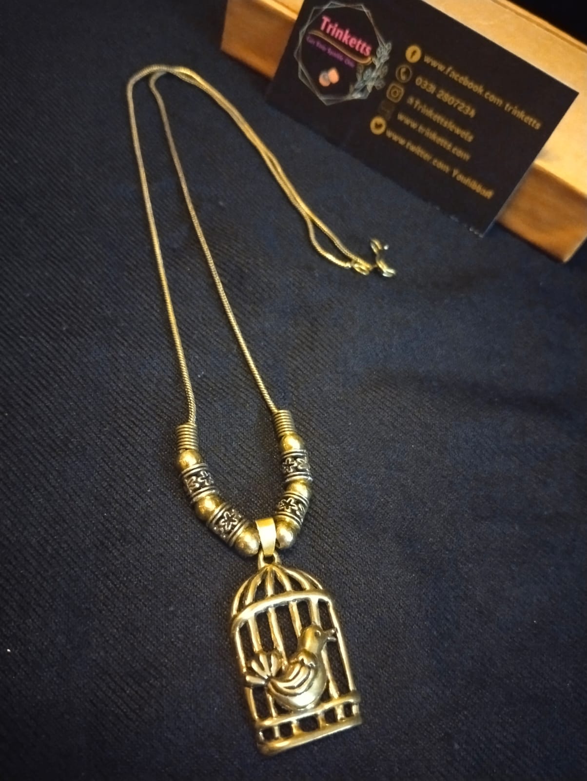 Full Oxidized Golden and Silver Maala Pendant with Chain: A captivating pendant with an intricate cage-style design, featuring a delicate bird motif suspended within, accompanied by an elegantly matching chain