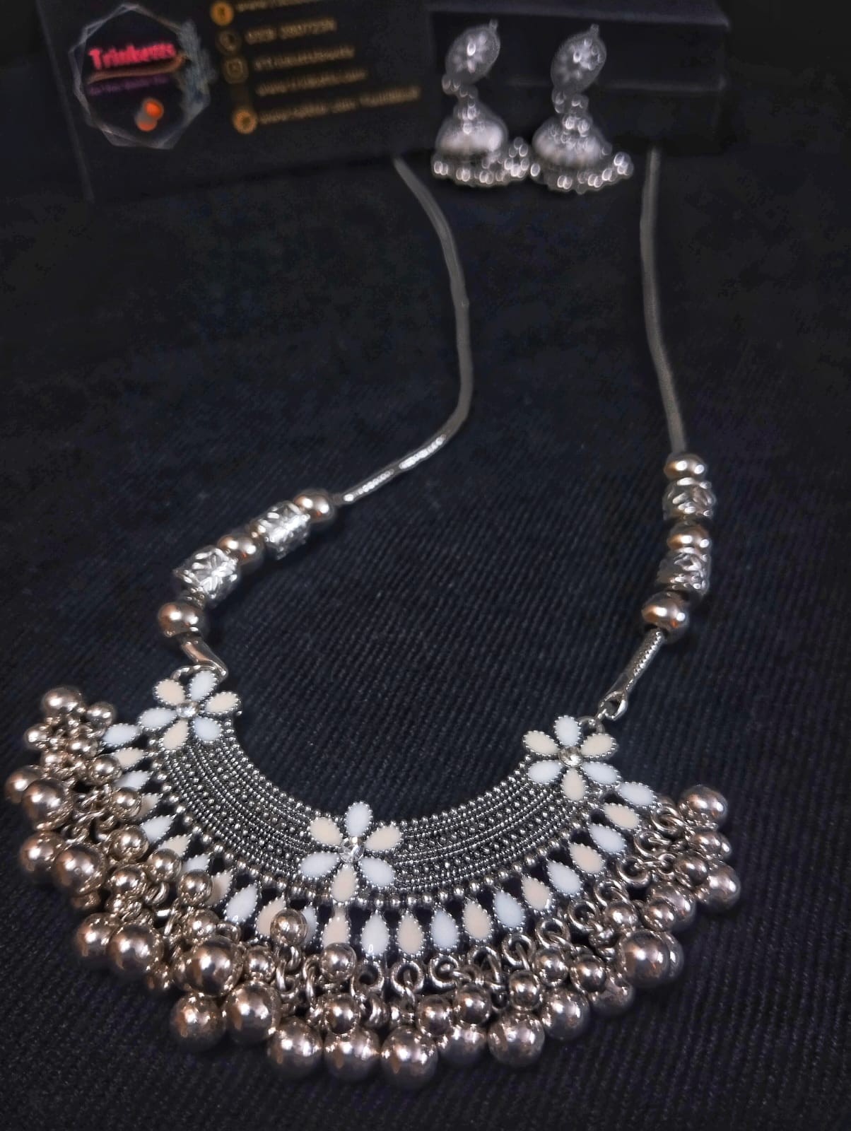 Silver Oxidized Meenakari Pendant Necklace with White and Off-White Pendant, Jhumkis, and Ghungroos