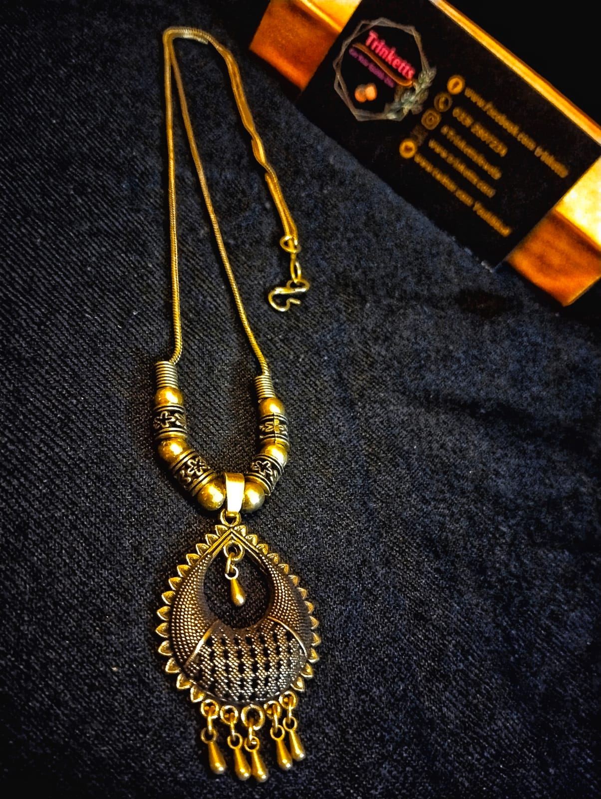 Oxidized Golden Chandelier Pendant Necklace on Display - Trinketts Jewelry