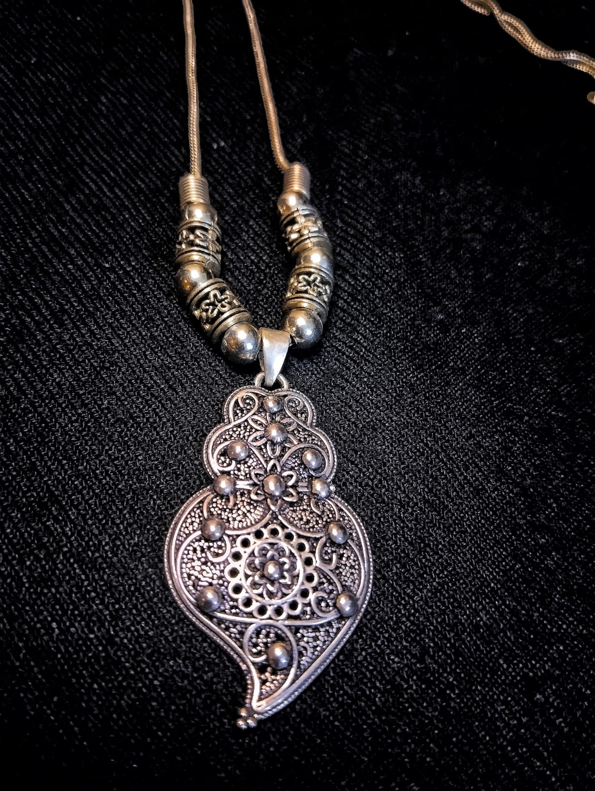 Close-up view of the intricate Filigree-Shaped Oxidized Silver Pendant, showcasing detailed filigree work and vintage silver finish.