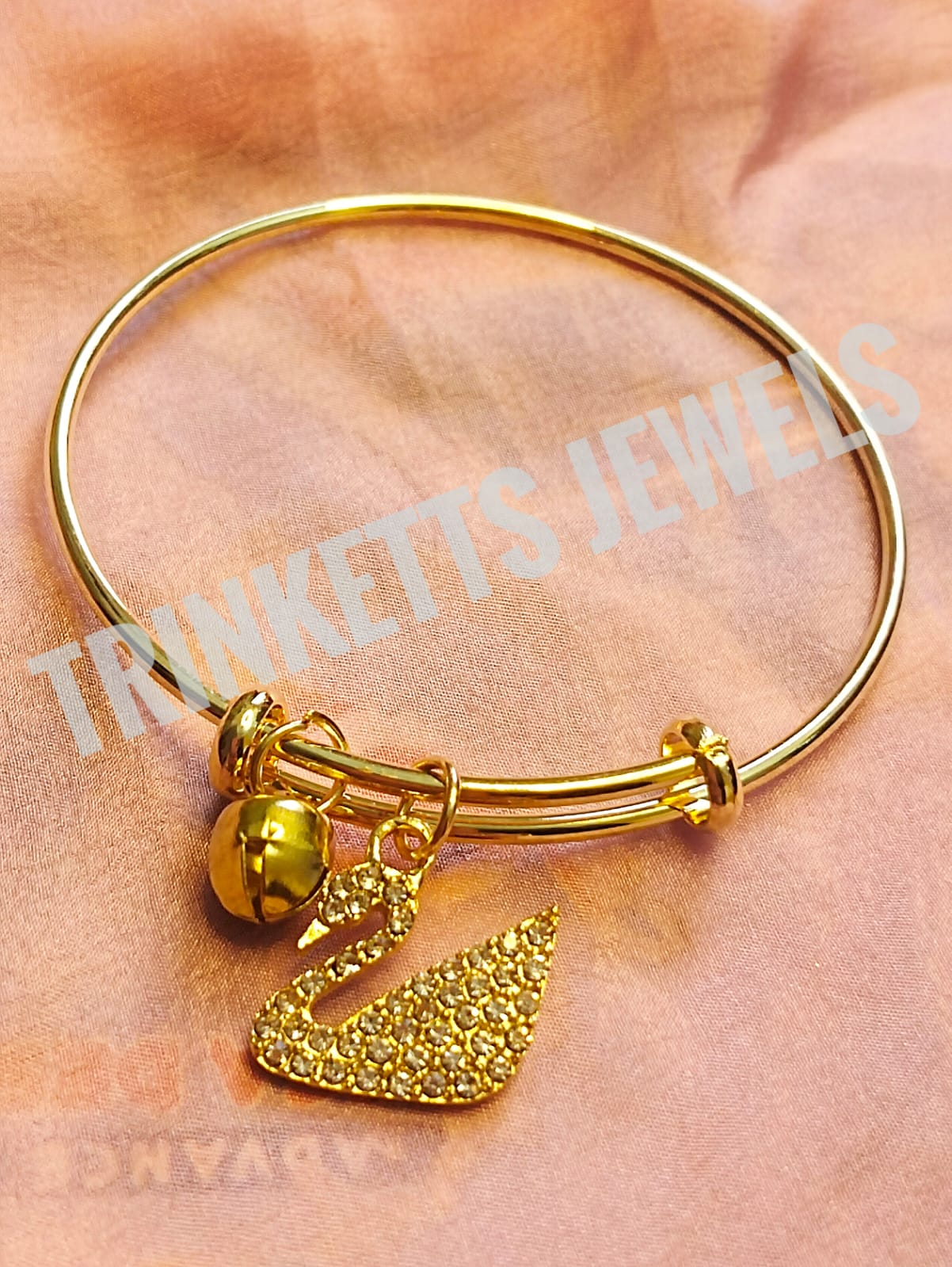 Delicate Golden Bangle Bracelet with Swan Charm and Ghungroo Accent