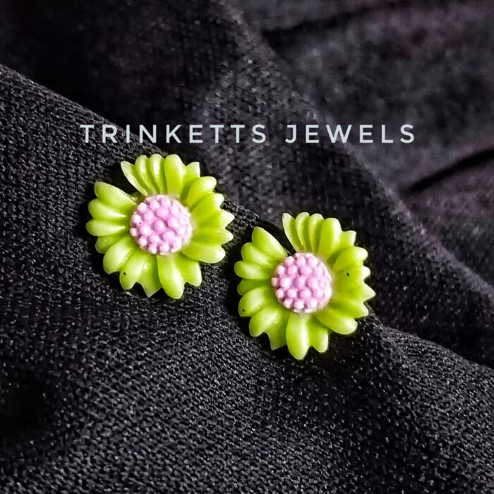 Trinketts' Daisy Delight Mini Studs Collection with Metal Back and Stoppers - Rs. 100 Each. Vibrant daisy-shaped studs with unique color combination of light pink in the center with parrot green petals. Perfectly priced for Pakistani customers.