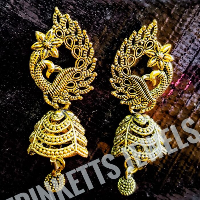 Oxidized Peacock Style Golden Jhumki with Intricate Wavy Design. Upper part features a majestic peacock with a flower, while the lower plate showcases intricate wavy patterns. Priced at Rs. 250. Perfect for Pakistani fashion enthusiasts. Elevate your look with this cultural masterpiece.