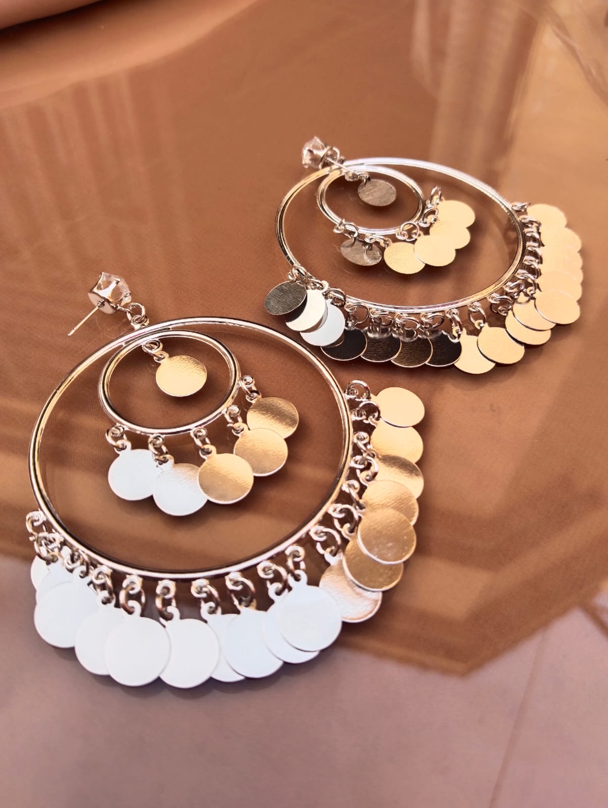 "Trinketts Dazzling Hoop Ensemble Earrings - Golden Shiny Hoops with Coin-Like Hangings, Lightweight and Statement-Making, Approx. 3 Inches in Size, Affordable Luxury at Rs. 380."