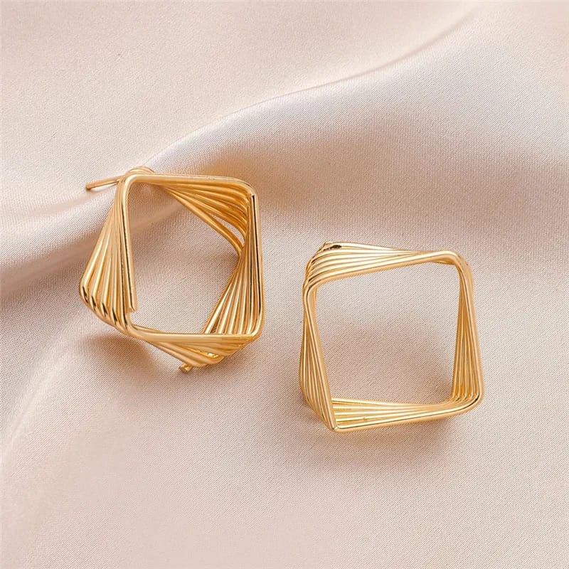 Trinketts Geometric Radiance Earrings in Golden, showcasing intricate wired designs forming geometric patterns, a chic blend of sophistication and contemporary allure."